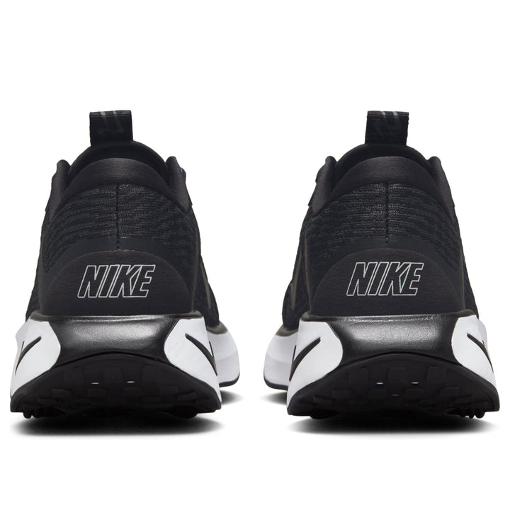 NIKE MOTIVA BLACK WHITE WOMENS
